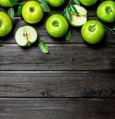 Green apples with leaves and Apple slices.