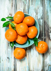Ripe mandarins in the bowl.