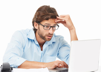 Shock, surprise and businessman on a laptop working on a project with a deadline in a studio. Shocked, wow and professional male employee gasping while doing research on computer by white background.
