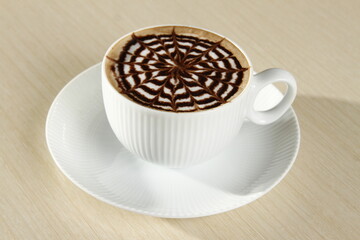 Cappuccino with foam art chocolate pattern
