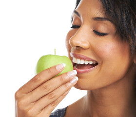 Woman, studio and apple with smile, nutrition and hungry for healthy, organic snack and eating by white background. Black woman, happy and natural green fruit for diet, energy or wellness by backdrop