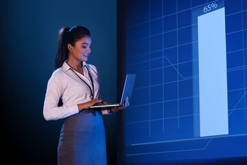 Female Technician working on the server in the data storage room