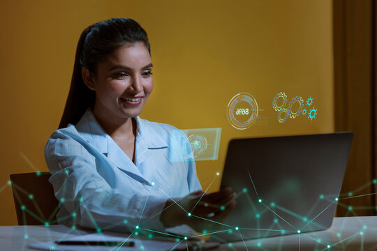 Businesswoman Working On Laptop Computer With Icons On Virtual Screen