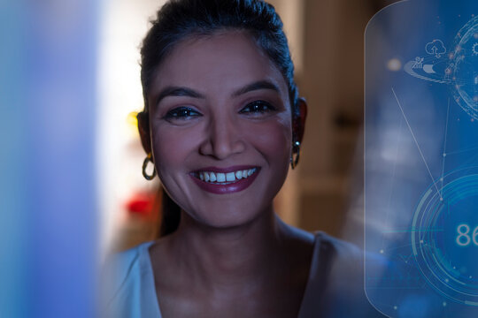 Businesswoman Smiling with icons on virtual screen
