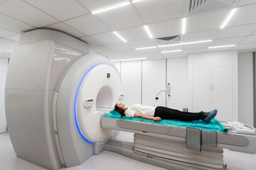Medical CT or MRI Scan in the modern hospital laboratory. Interior of radiography department. Technologically advanced equipment in white room. Magnetic resonance diagnostics machine - obrazy, fototapety, plakaty