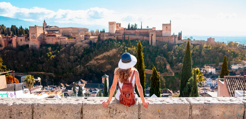 Fototapeta Woman tourist looking at Ancient arabic fortress Alhambra- Granada in Spain obraz