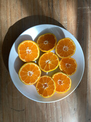 cut oranges on a plate