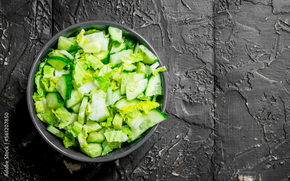 Sticker Vegetable salad. Simple salad of cucumbers and Chinese cabbage with olive oil and spices.