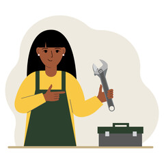 A woman holds an adjustable wrench in his hand and a tool box next to it. The concept of technical repair or service.