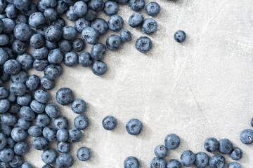 Fresh blueberries on gray background. Blueberries background. Healthy berry, organic food,...