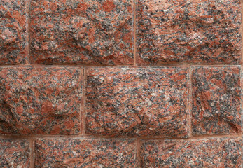 Red granite natural stone wall....