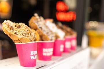 Different types of bubble waffle ice cream to go.