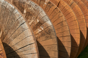 Closeup of old wooden screw pump to pump water from low to high. Also known as Archimedes screw pump or water screw.  - obrazy, fototapety, plakaty