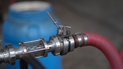 Barrels with a tap and a hose for production of beer or wine