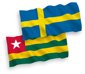 Flags of Sweden and Togolese Republic on a white background