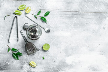 Shaker and fresh juicy lime.