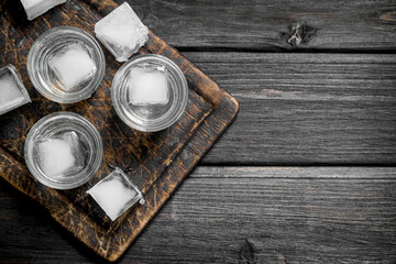 Vodka on the ice on the cutting Board.