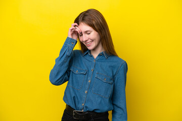 Young English woman isolated on yellow background laughing