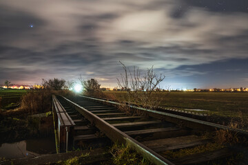 Railway at the starry night - 561217471