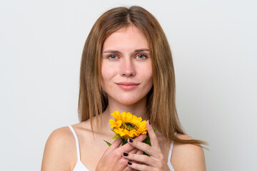 Young English woman holding a sunflower. Close up portrait