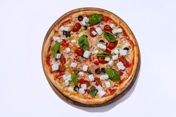 freshly baked pizza with feta cheese slicers on white background