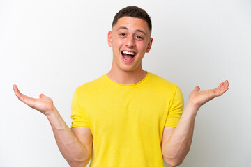 Young brazilian man isolated on white background with shocked facial expression