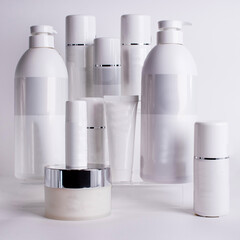 packaging, bottles, containers for cosmetics and other products on a light background close-up
