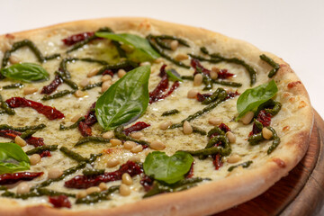 Top view of freshly backed pizza on white background