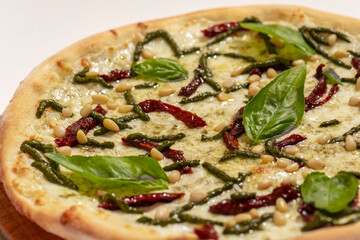 Top view of freshly backed pizza on white background
