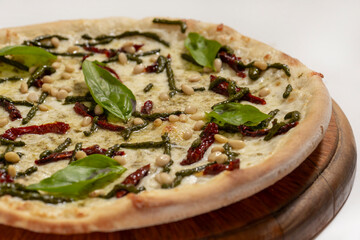 Top view of freshly backed pizza on white background