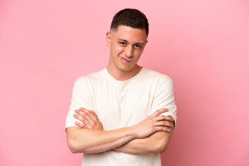 Obraz premium Young Brazilian man isolated on pink background feeling upset