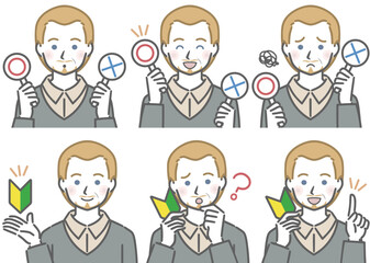 〇✕マークや初心者マークを持つ、中年の白人男性