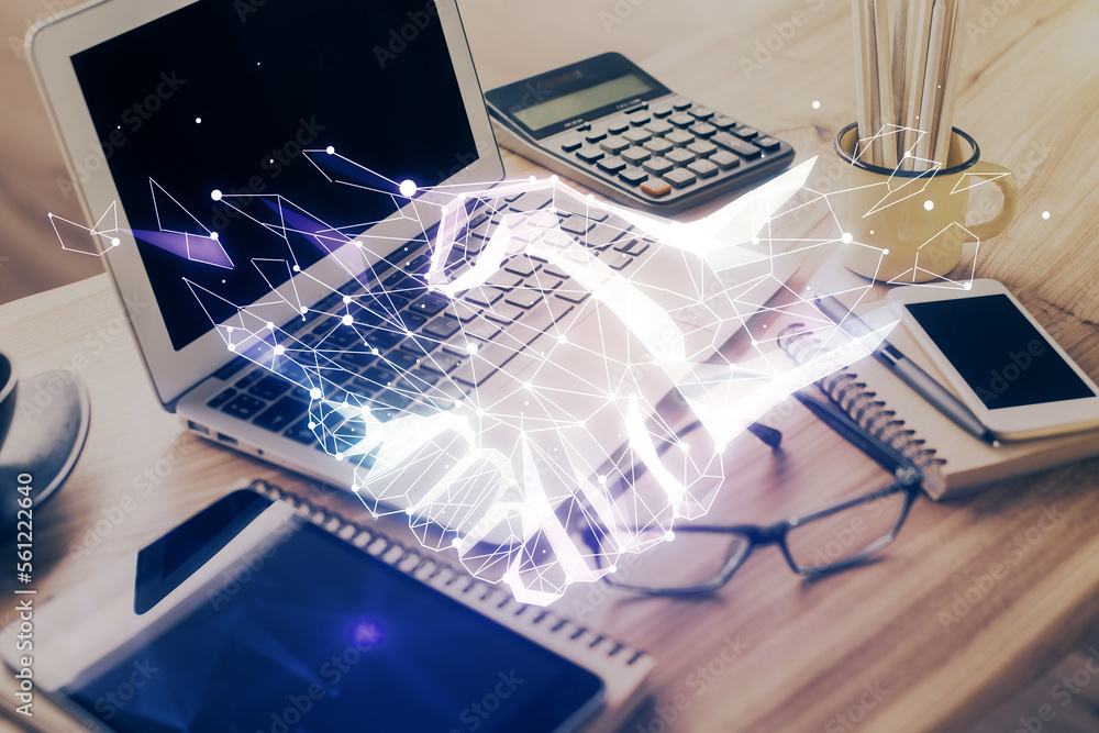 Poster desktop computer background in office and handshake hologram drawing. double exposure. pertnership c