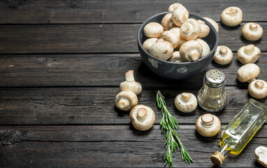 Fresh mushrooms in bowl with seasonings.