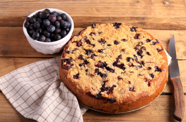 cake with berries and crumble topping