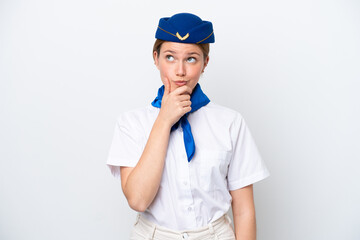 Airplane stewardess woman isolated on white background having doubts and with confuse face expression