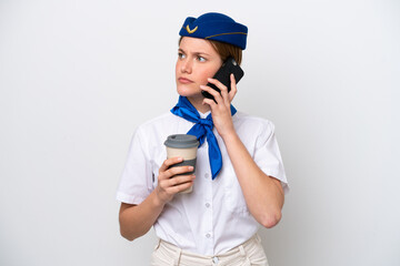 Airplane stewardess woman isolated on white background holding coffee to take away and a mobile