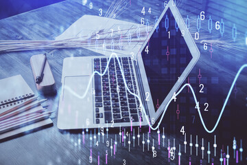 Forex market graph hologram and personal computer on background. Multi exposure. Concept of investment.