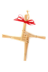 Saint Brigids Cross Irish pagan symbol of house blessing protection from evil and fire. Traditionally made in Ireland on Imbloc first day of Spring St Brigids feast day. On white top view.