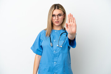 Young surgeon doctor woman isolated on white background making stop gesture