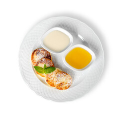 Cheese pancake with sauce cream on plate