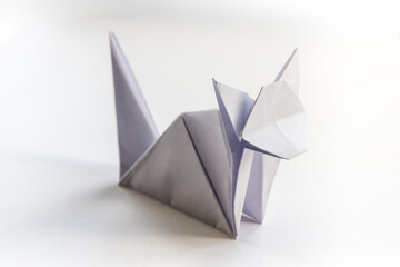 Paper cat origami isolated on a white background