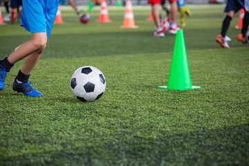  Boys Soccer ball tactics on grass field with cone