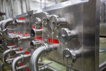 Fototapeta premium Pipe Modern coconut milk cellar with stainless steel tanks