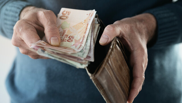 Hands taking out money from wallet