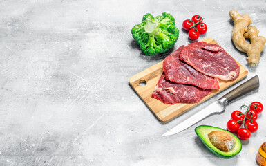Organic food. Variety of healthy food with beef steaks .