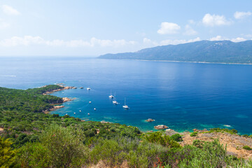 Fototapeta na wymiar Corsica island on a sunny day, Cupabia gulf. Summer landscape