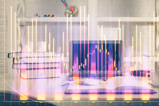 Forex market graph hologram and personal computer on background. Multi exposure. Concept of investment. © peshkova