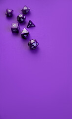 Purple background with purple dice. Place for text, free space.