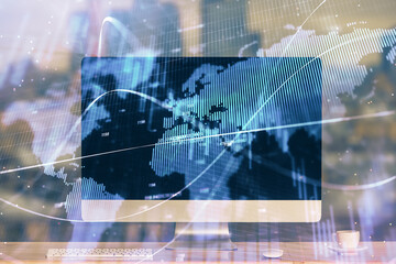 Financial market graph hologram and personal computer on background. Double exposure. Concept of forex.